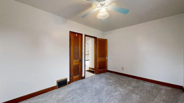 an empty room with fan