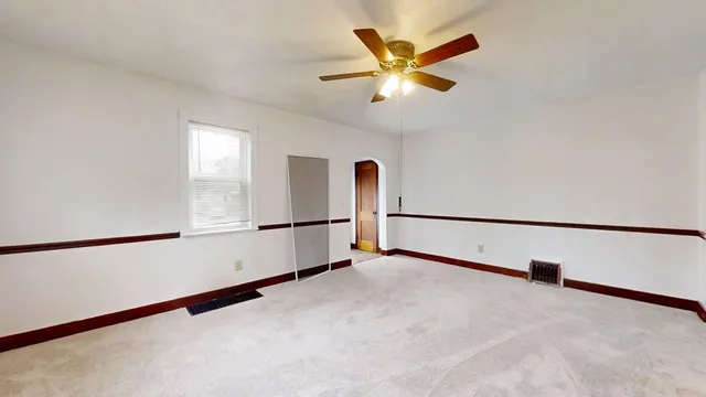 a view of a livingroom with a ceiling fan