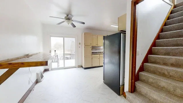 a view of an entryway with wooden floor and a chandelier