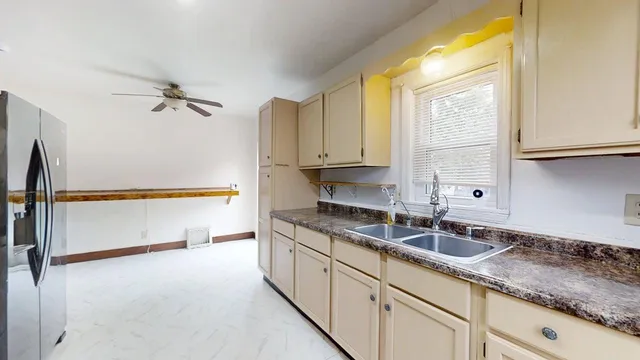 a kitchen with a sink and a window