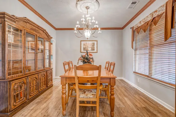 a kitchen that has a lot of cabinets in it and appliances
