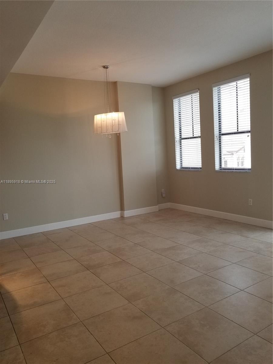 55 Merrick Way, Unit 828 Coral Gables, FL 33134 - Photo 15 of 17 a view of an empty room with a window