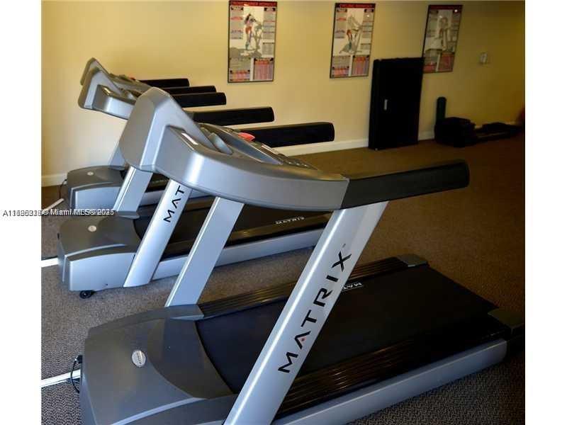 55 Merrick Way, Unit 828 Coral Gables, FL 33134 - Photo 17 of 17 a kitchen with a stove and a microwave