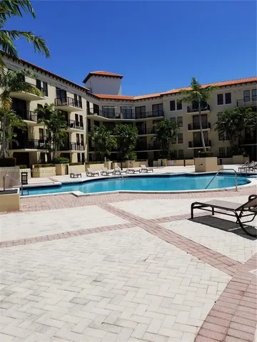 a view of swimming pool with outdoor seating