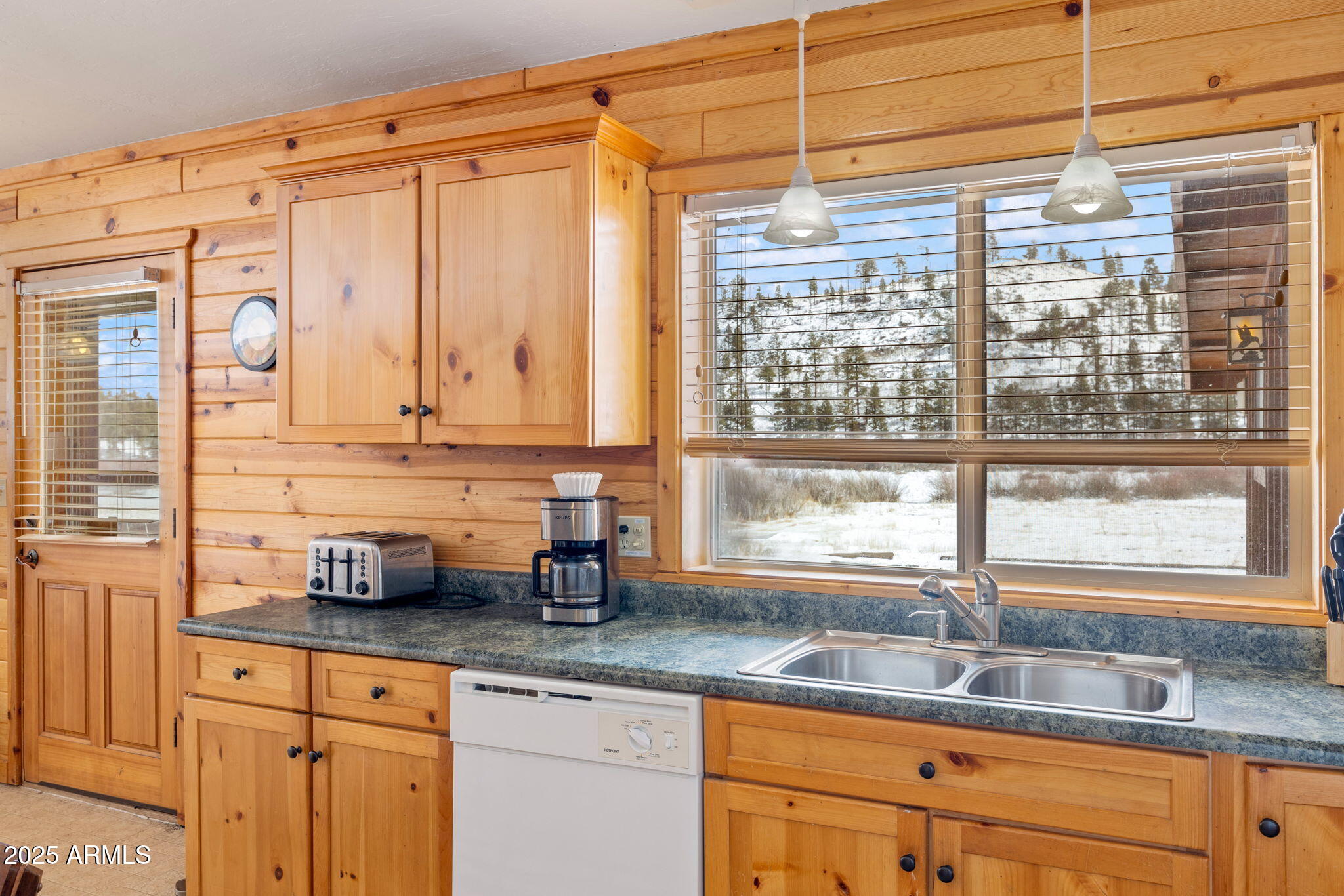 100 Main Street Greer, AZ 85927 - Photo 41 of 63 a kitchen with granite countertop a sink and a window