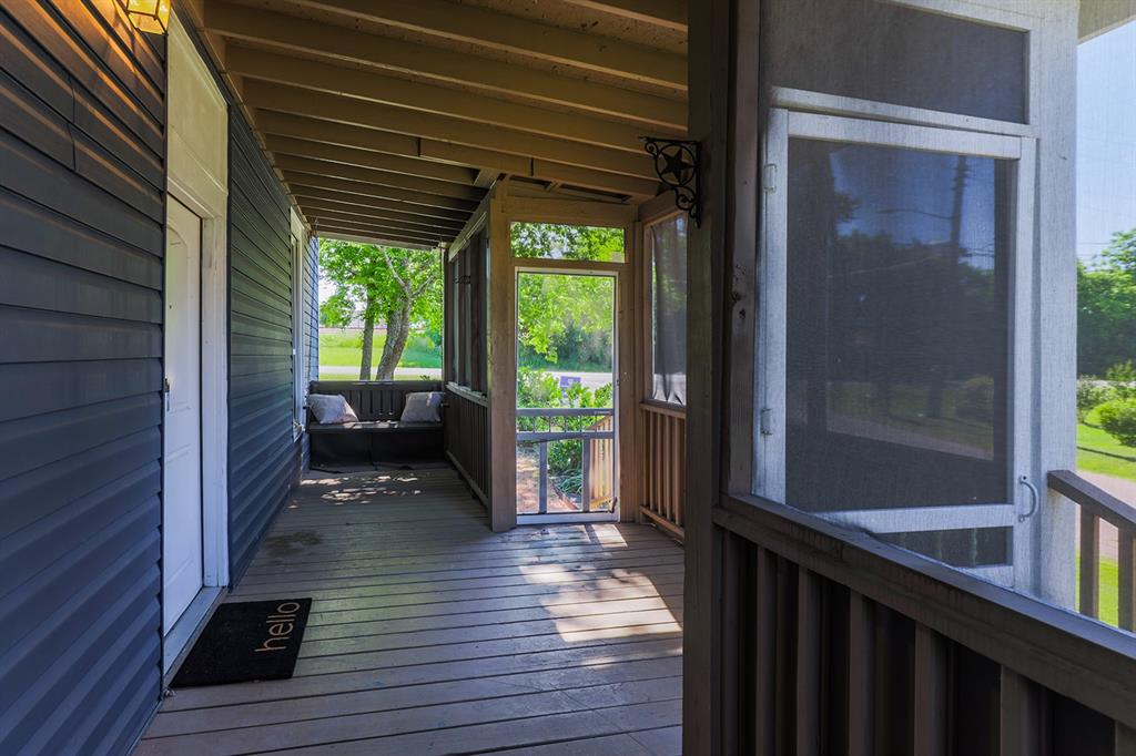 453 East Marshall Street Van Alstyne, TX 75495 - Photo 5 of 30 a view of a balcony with wooden floor