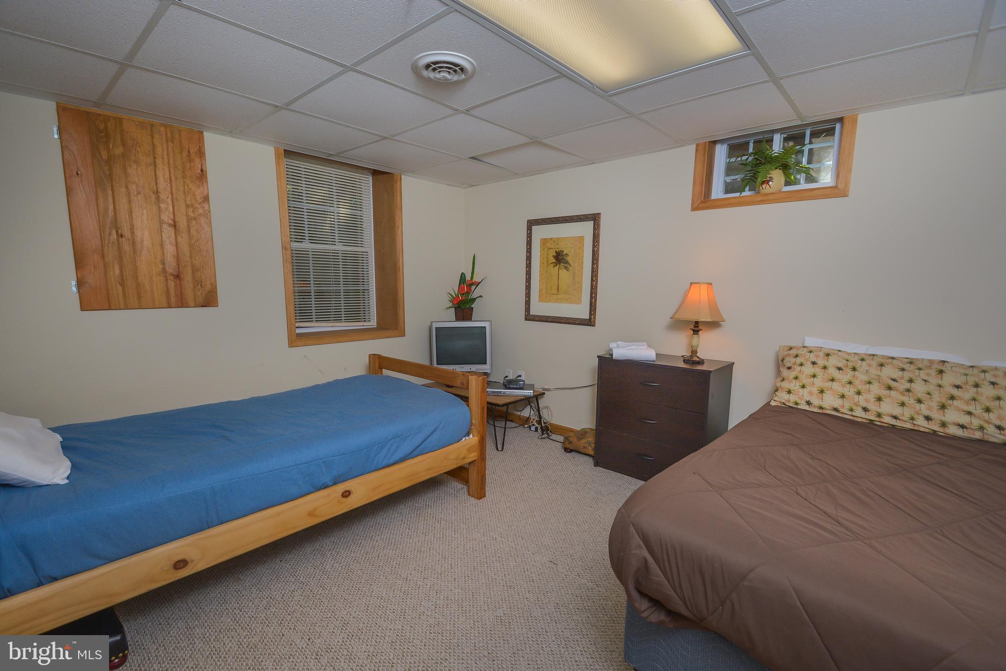 1417 Marsh Hill Road McHenry, MD 21541 - Photo 11 of 34 a bed room with a bed and a couch