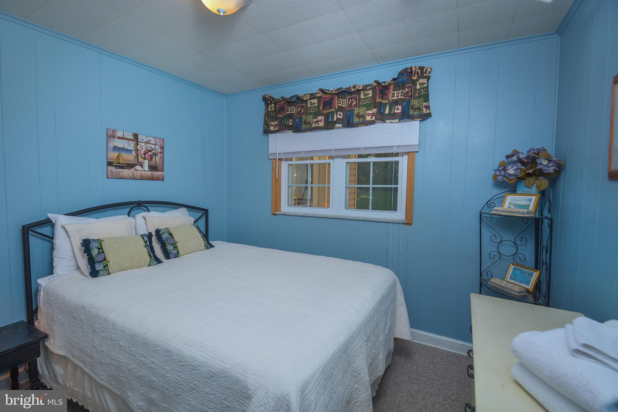 1417 Marsh Hill Road McHenry, MD 21541 - Photo 12 of 34 a bedroom with a bed and a window