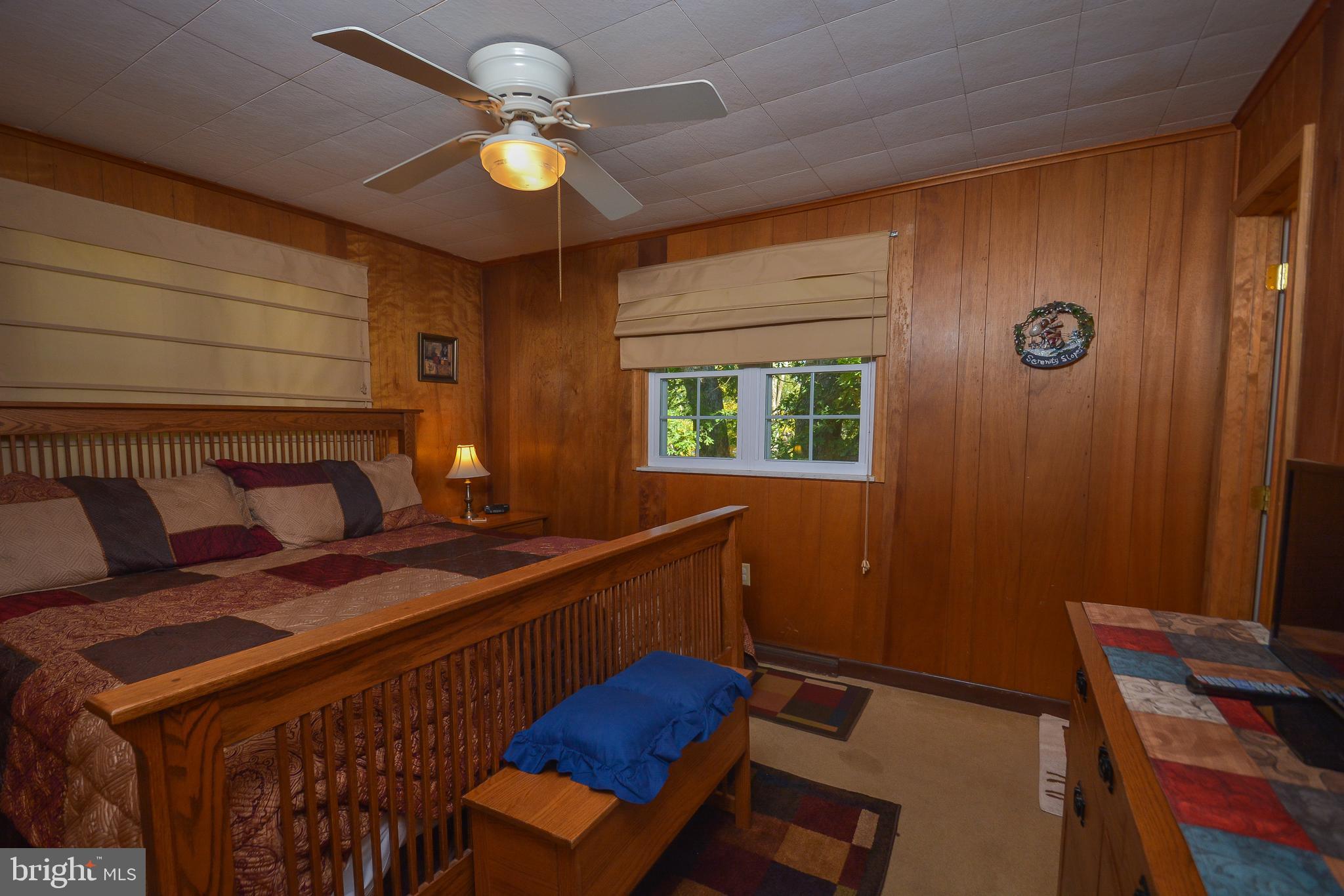 1417 Marsh Hill Road McHenry, MD 21541 - Photo 14 of 34 a bed room with a bed and a window