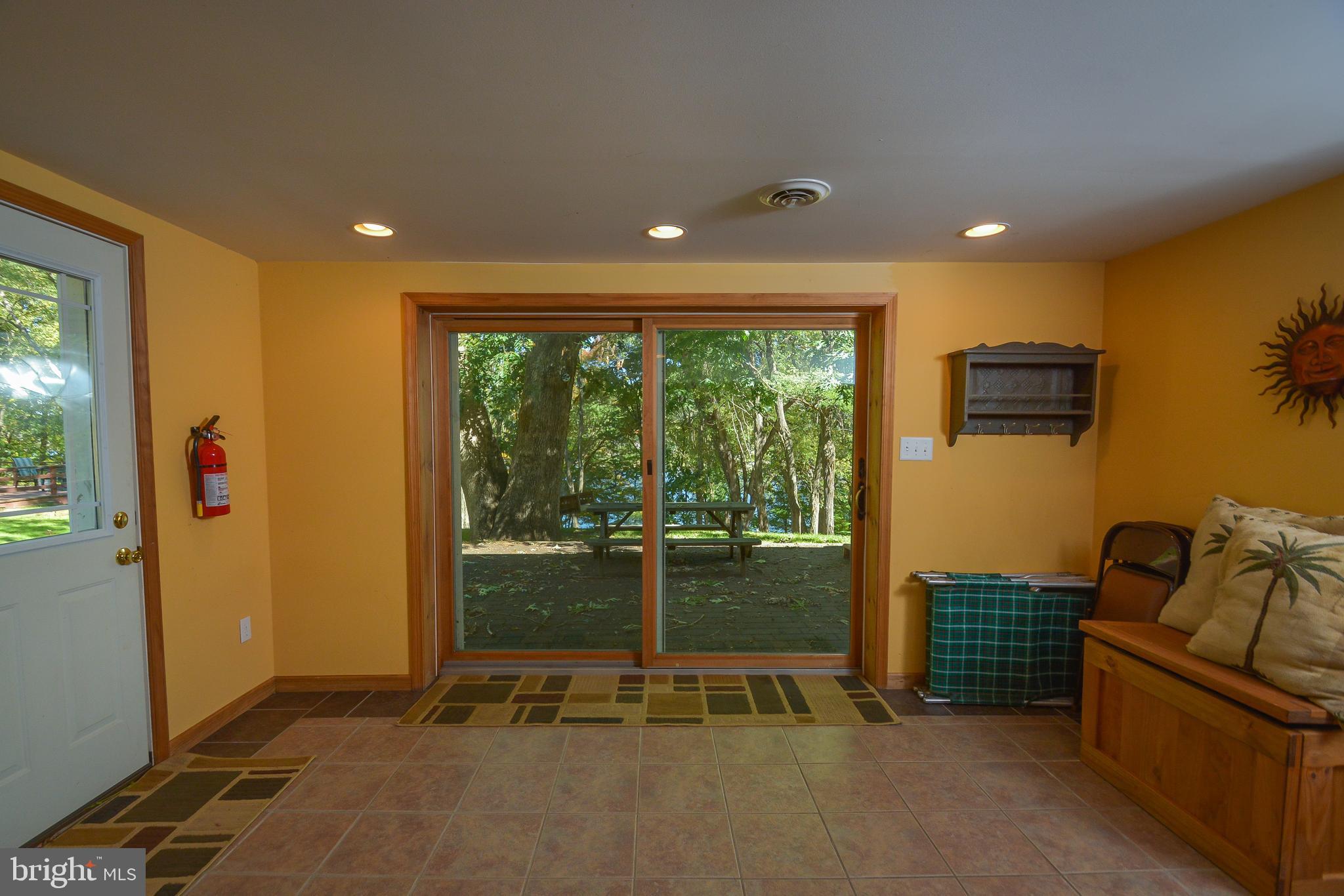 1417 Marsh Hill Road McHenry, MD 21541 - Photo 18 of 34 a view of a livingroom with furniture and floor to ceiling window