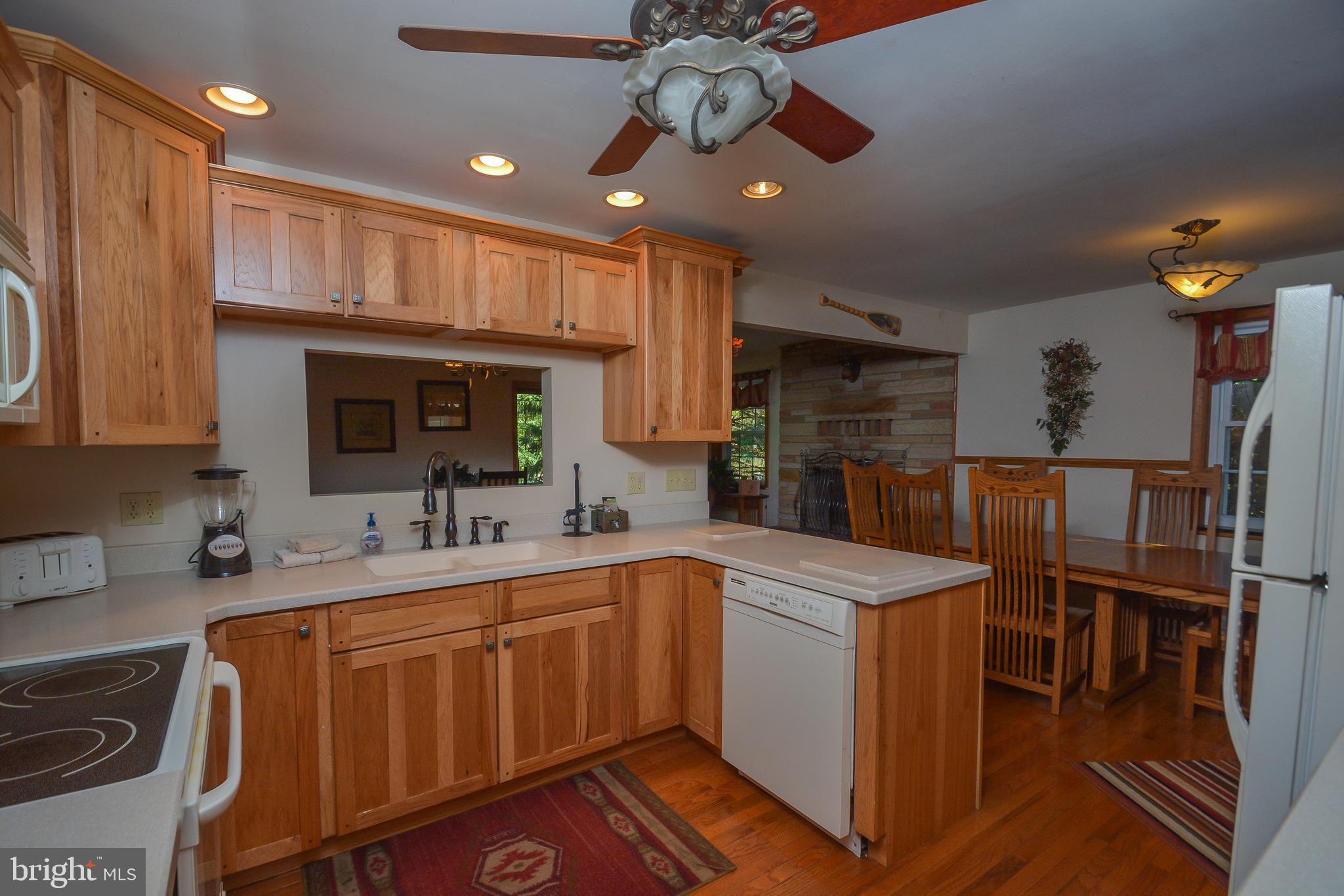 1417 Marsh Hill Road McHenry, MD 21541 - Photo 8 of 34 a kitchen with sink cabinets and wooden floor