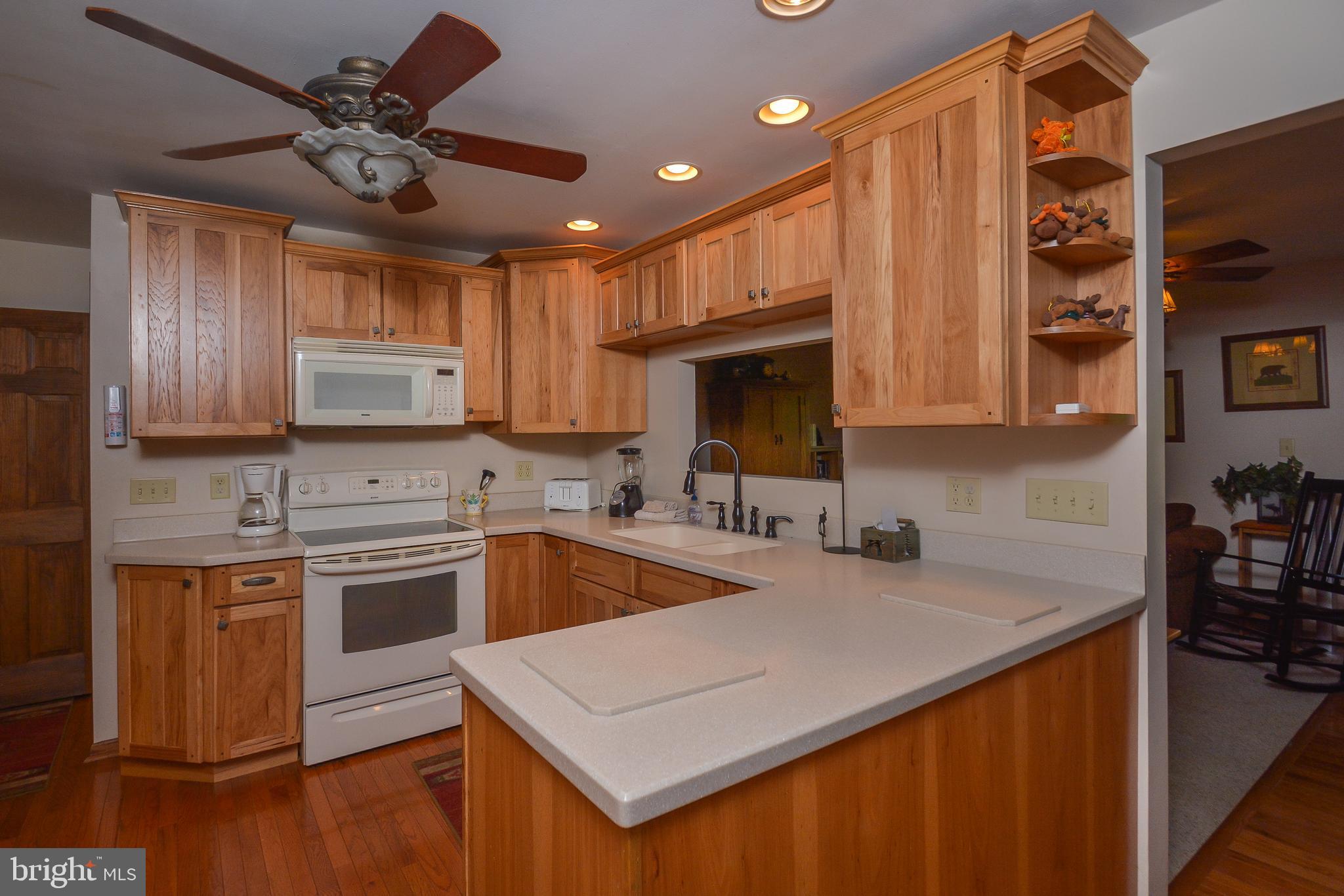 1417 Marsh Hill Road McHenry, MD 21541 - Photo 9 of 34 a kitchen with stainless steel appliances granite countertop a sink a stove and cabinets
