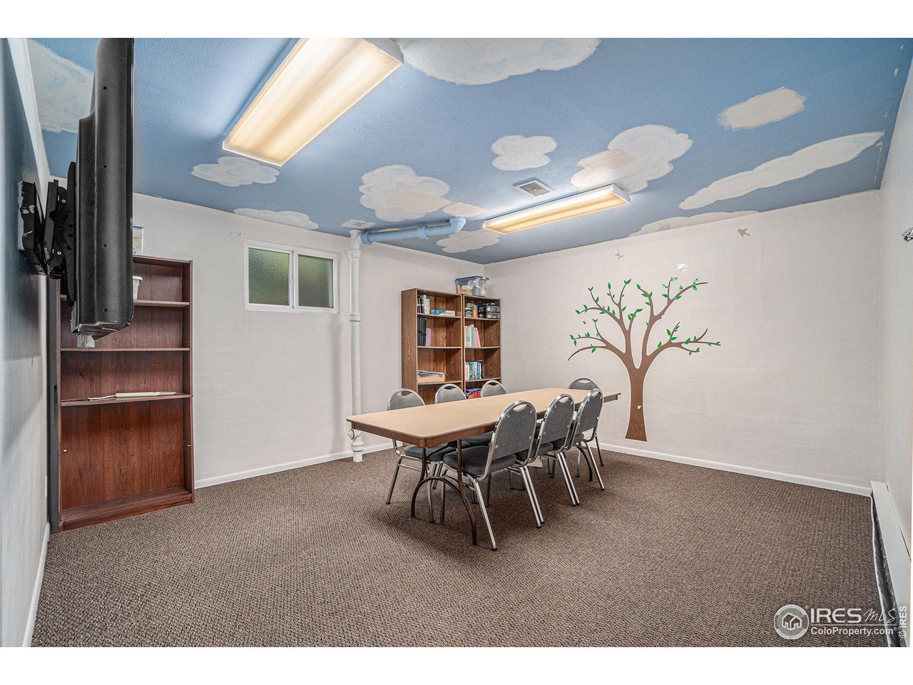 601 South Whitcomb Street Fort Collins, CO 80521 - Photo 20 of 34 a view of a dining room with furniture and chandelier