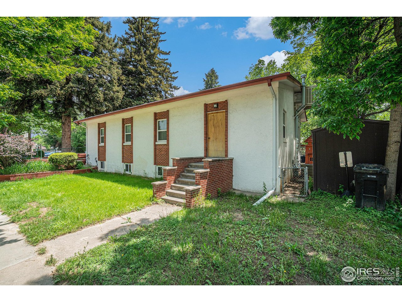 601 South Whitcomb Street Fort Collins, CO 80521 - Photo 30 of 34 a view of a backyard with a garden