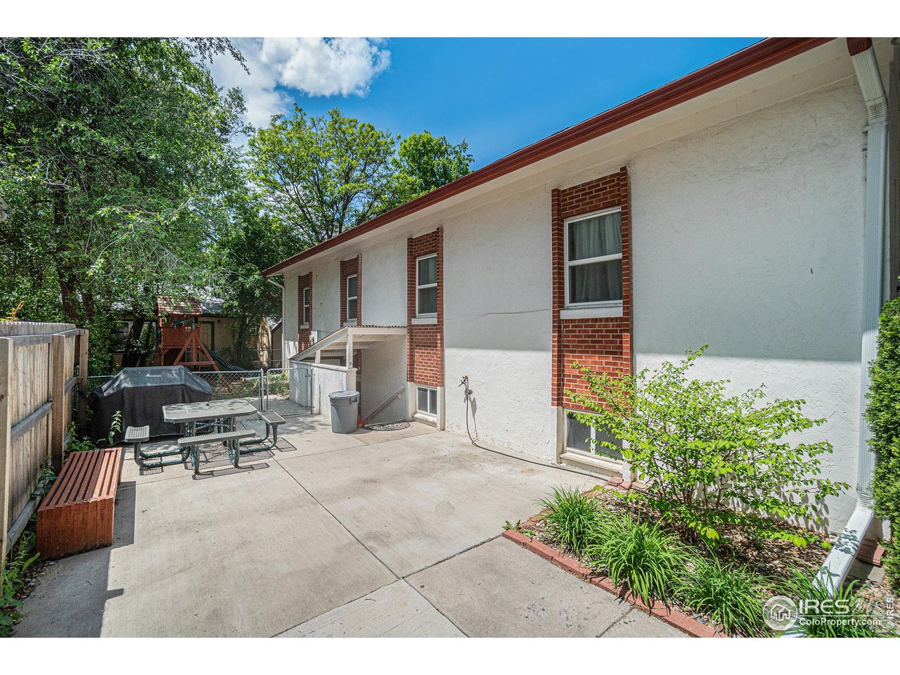 601 South Whitcomb Street Fort Collins, CO 80521 - Photo 31 of 34 a view of a backyard with furniture and a small yard