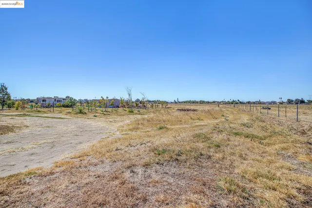 a view of beach with an ocean