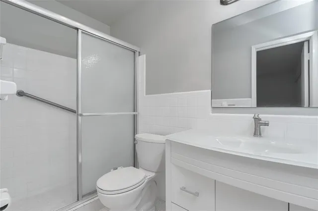 a kitchen with a sink and a refrigerator