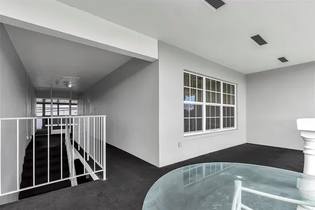 a view of a livingroom with a furniture and staircase