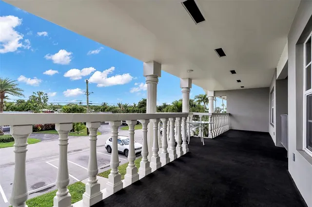 a view of balcony with furniture