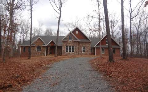 1 Barnes Chapel Road Blue Ridge, GA 30513 - Photo 1 of 1 a front view of a house with trees