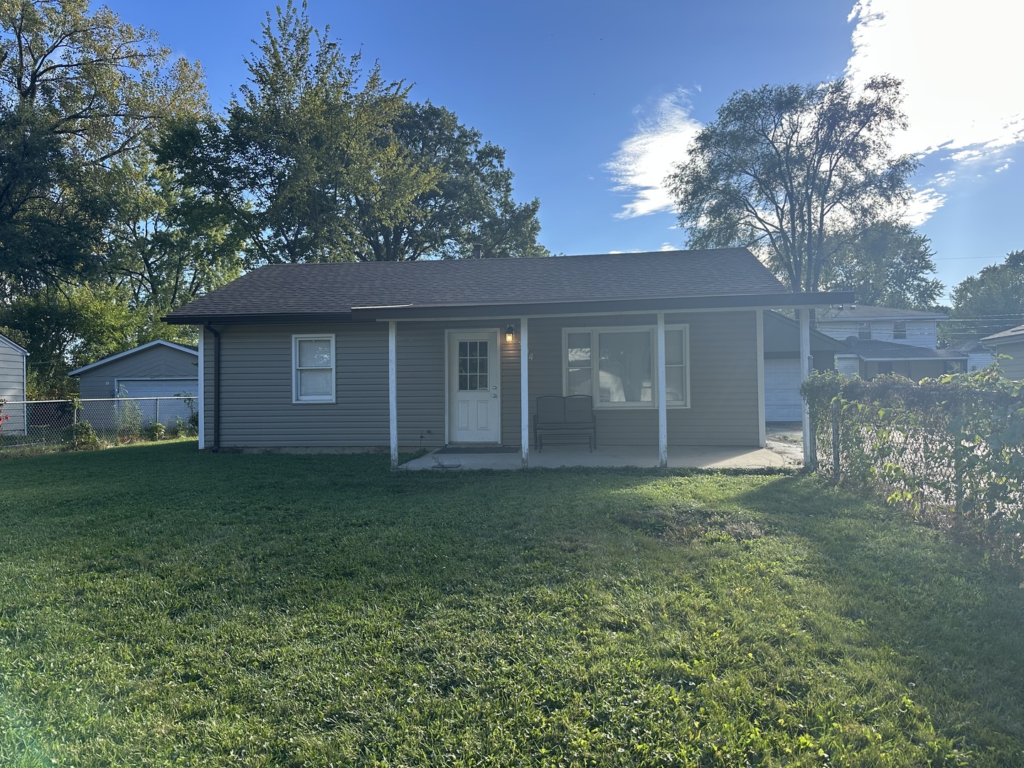 a backyard of a house with lots of green space