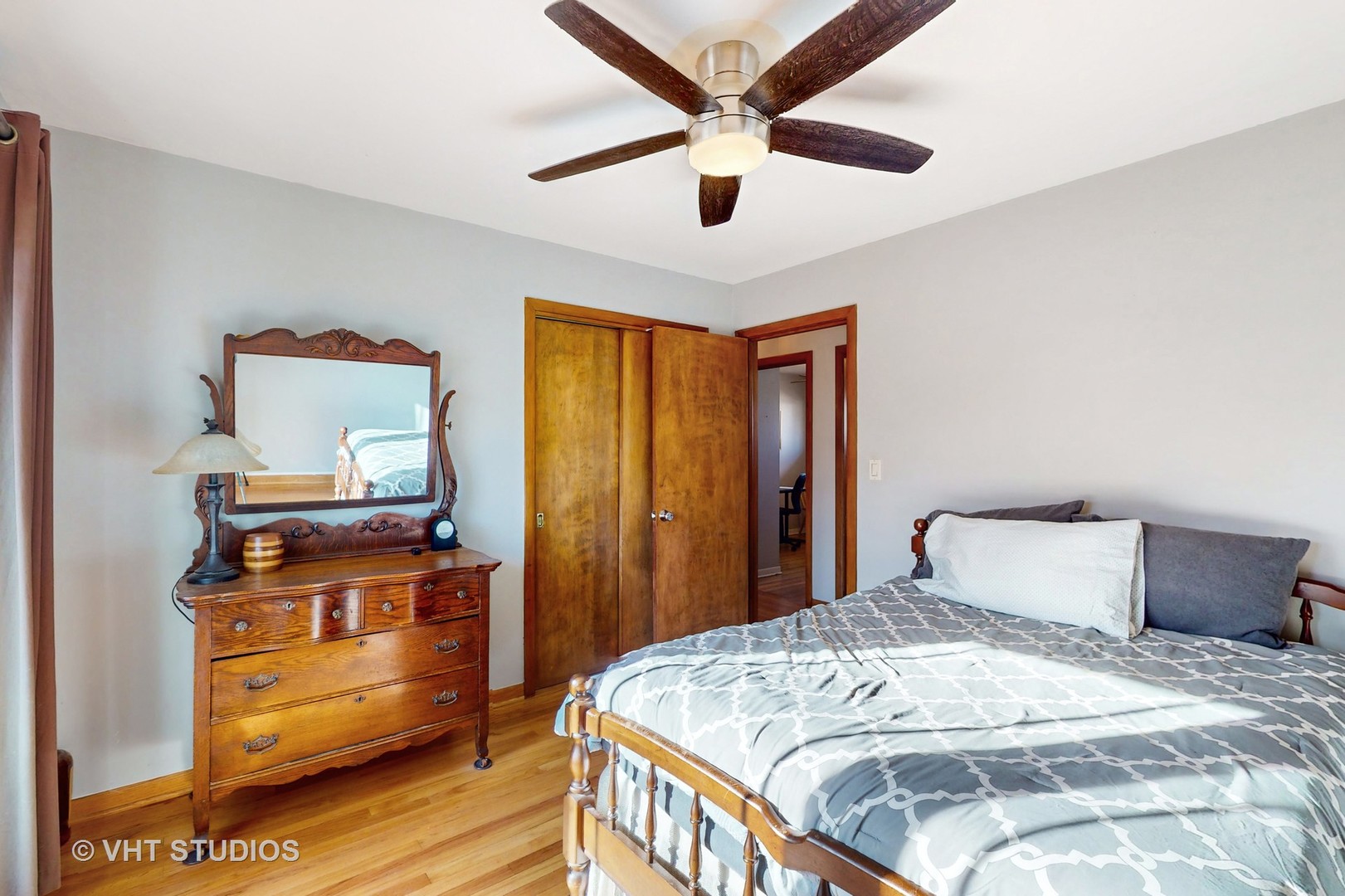 223 Highland Road Grayslake, IL 60030 - Photo 11 of 23 a bedroom with a bed and wooden floor