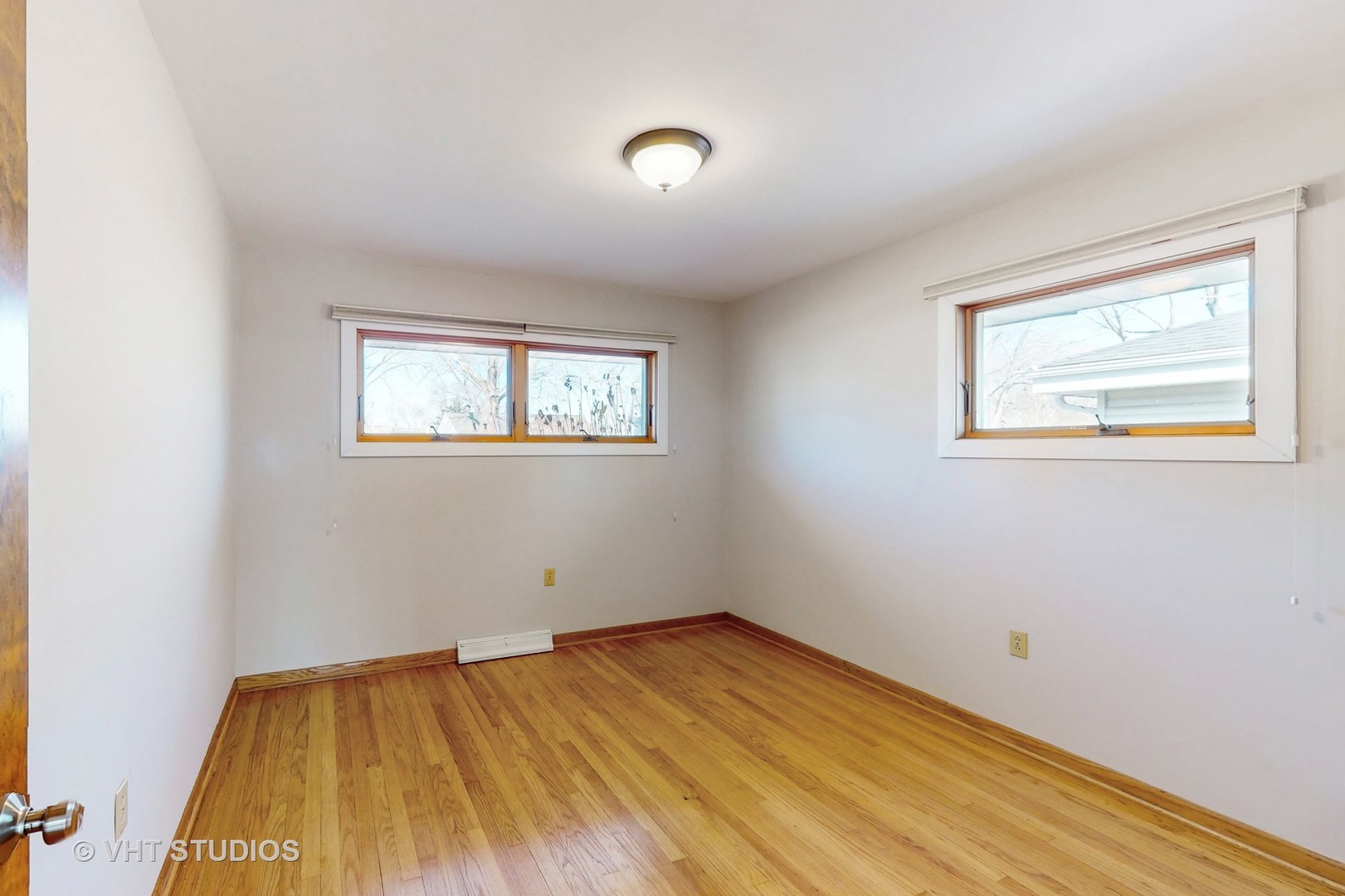 223 Highland Road Grayslake, IL 60030 - Photo 13 of 23 a view of empty room with wooden floor and fan