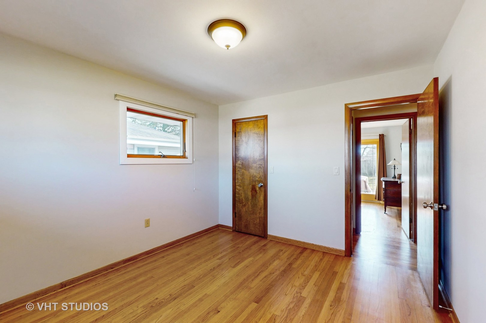 223 Highland Road Grayslake, IL 60030 - Photo 14 of 23 a view of a room with wooden floor and a window