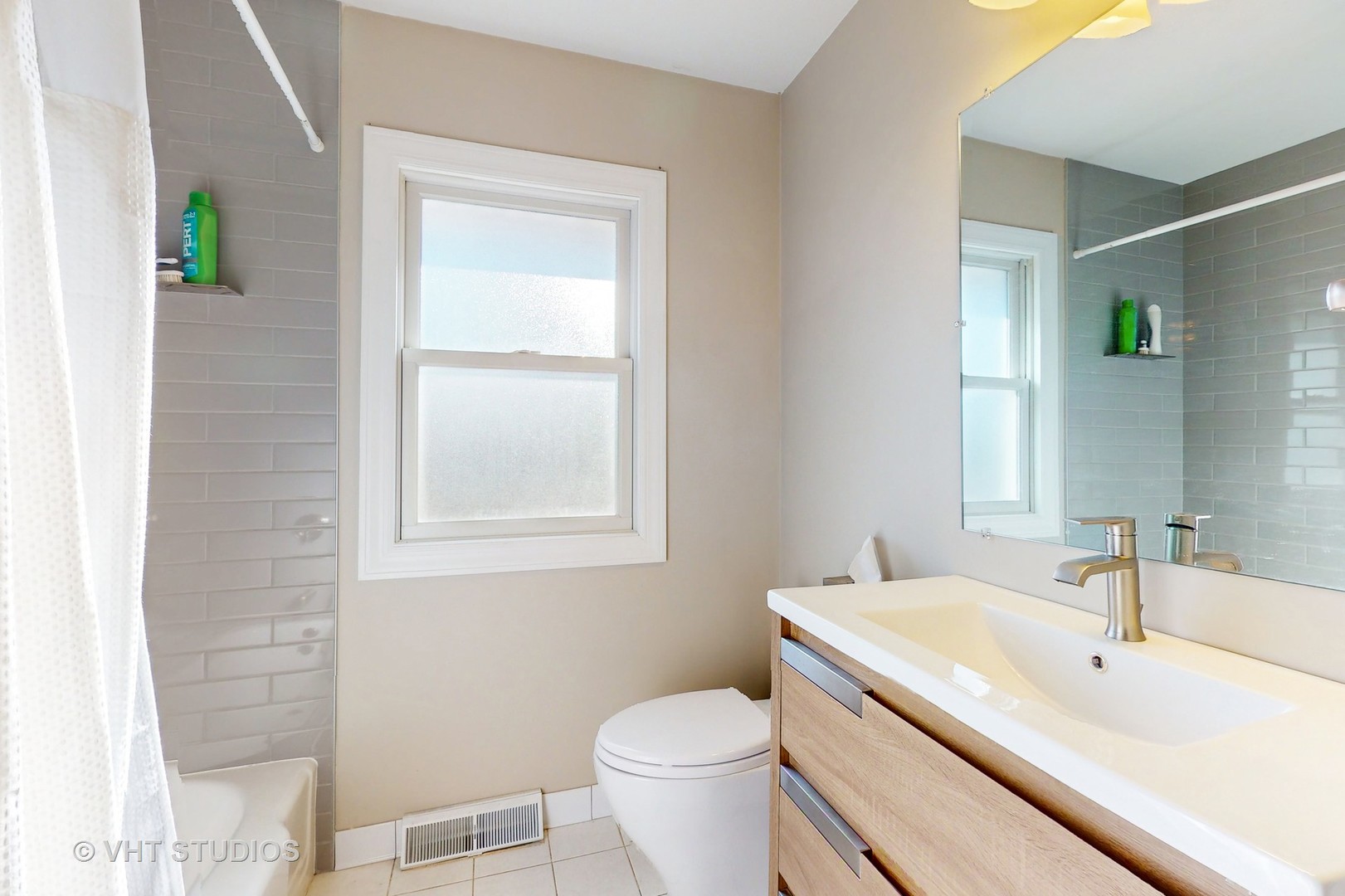 223 Highland Road Grayslake, IL 60030 - Photo 15 of 23 a bathroom with a sink toilet and vanity