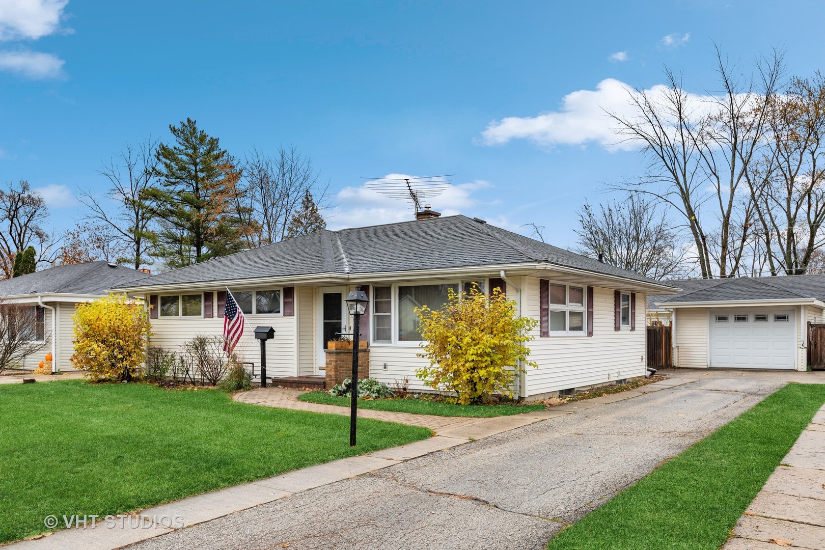 223 Highland Road Grayslake, IL 60030 - Photo 2 of 23 a front view of a house with garden