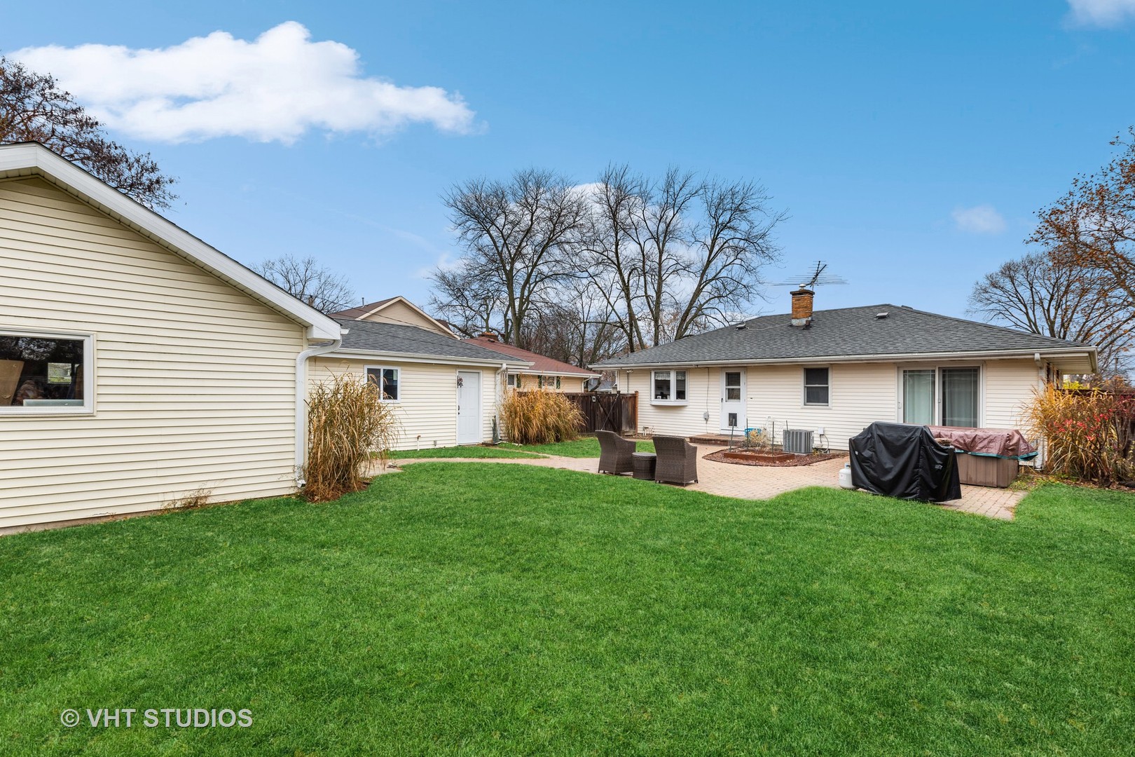223 Highland Road Grayslake, IL 60030 - Photo 8 of 23 a view of a house with a yard and sitting area