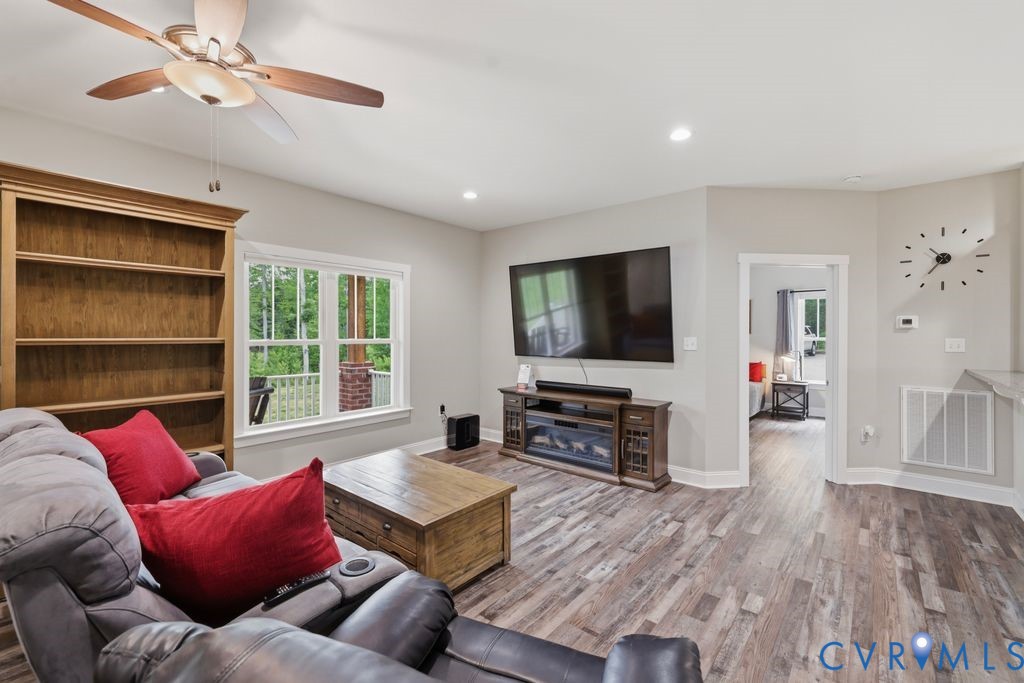 3259 Three Bridge Road Powhatan, VA 23139 - Photo 5 of 43 Spacious living area featuring wood-finish floorin