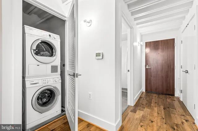 a view of a hallway with washer and dryer