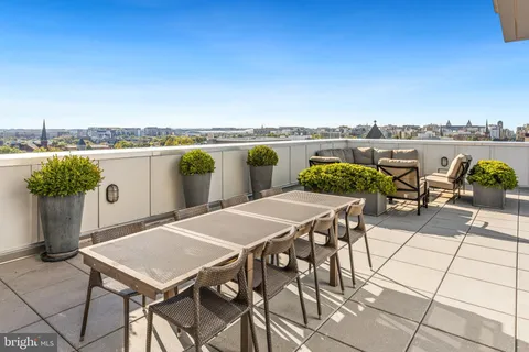 a view of a terrace with furniture and stove