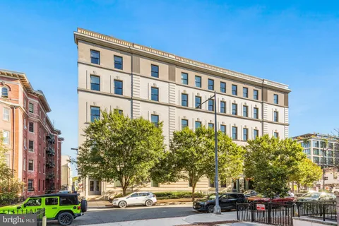 a front view of a building with street view