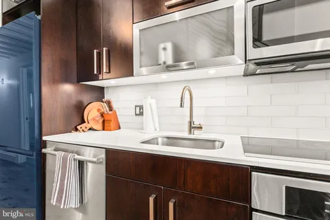a kitchen with a sink and cabinets