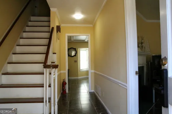 a kitchen with a refrigerator and cabinets