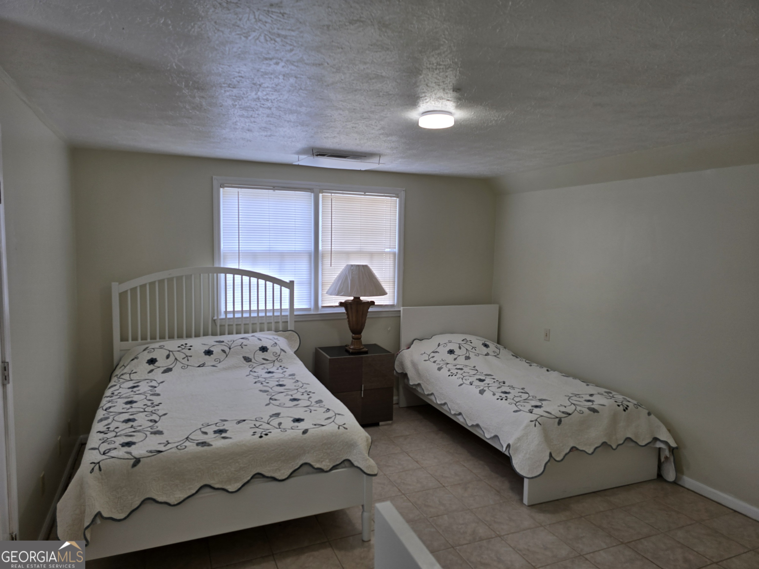 1903 Ridgewood Drive West Point, GA 31833 - Photo 19 of 27 a bedroom with two beds and a window