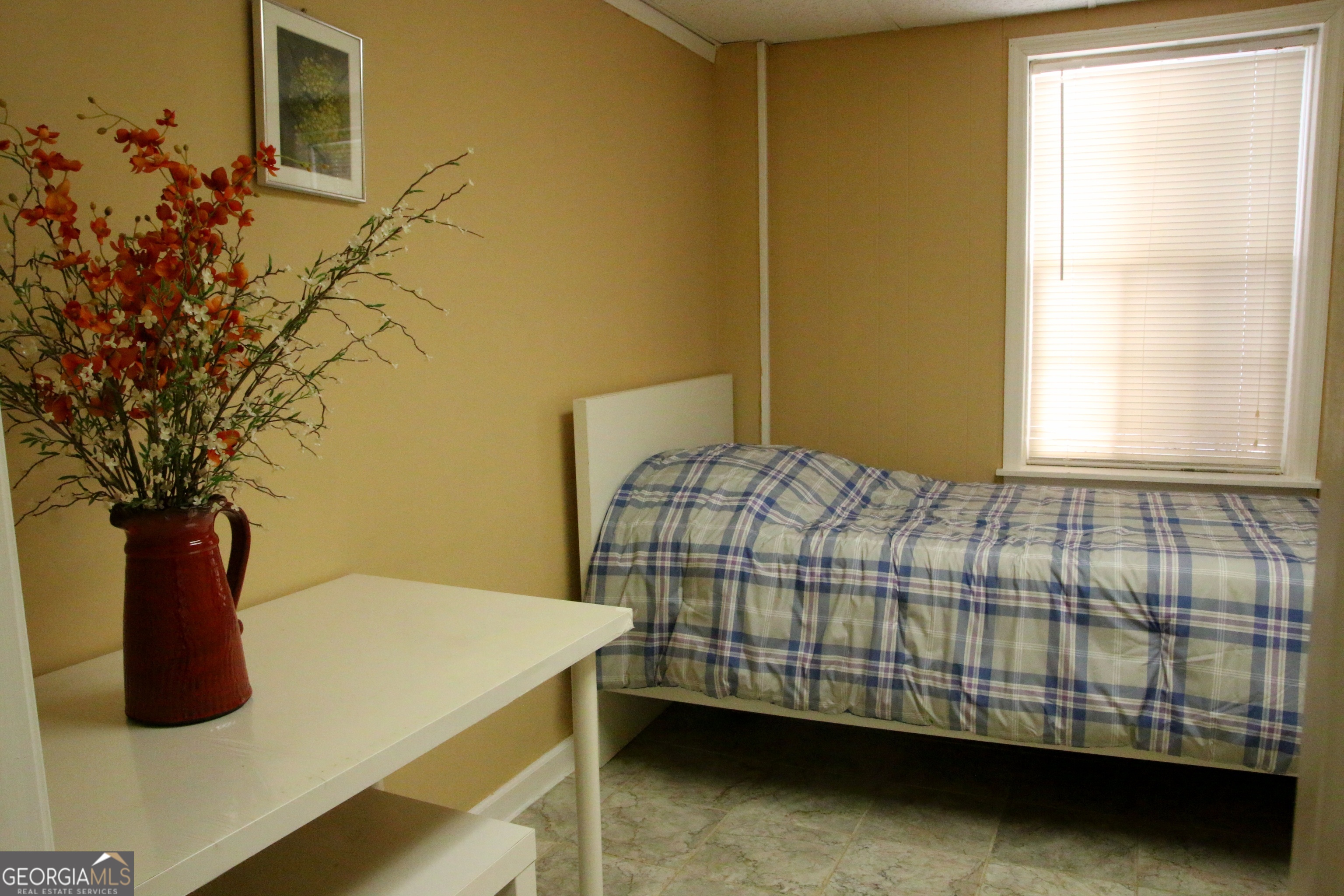 1903 Ridgewood Drive West Point, GA 31833 - Photo 24 of 27 a bedroom with a bed and a potted plant