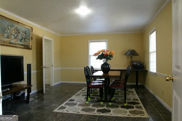 a view of a dining room with furniture