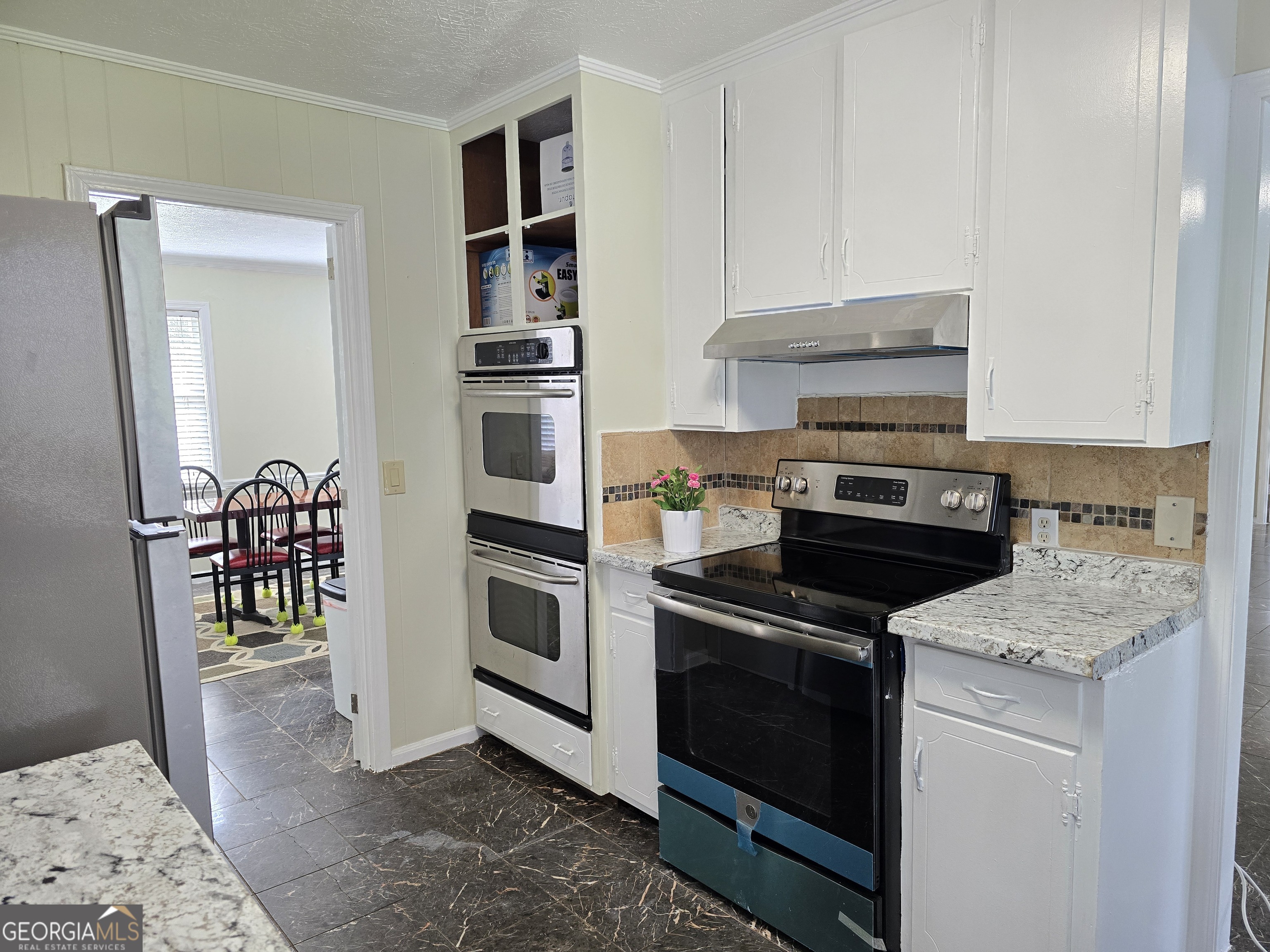 1903 Ridgewood Drive West Point, GA 31833 - Photo 8 of 27 a kitchen with a stove and a microwave