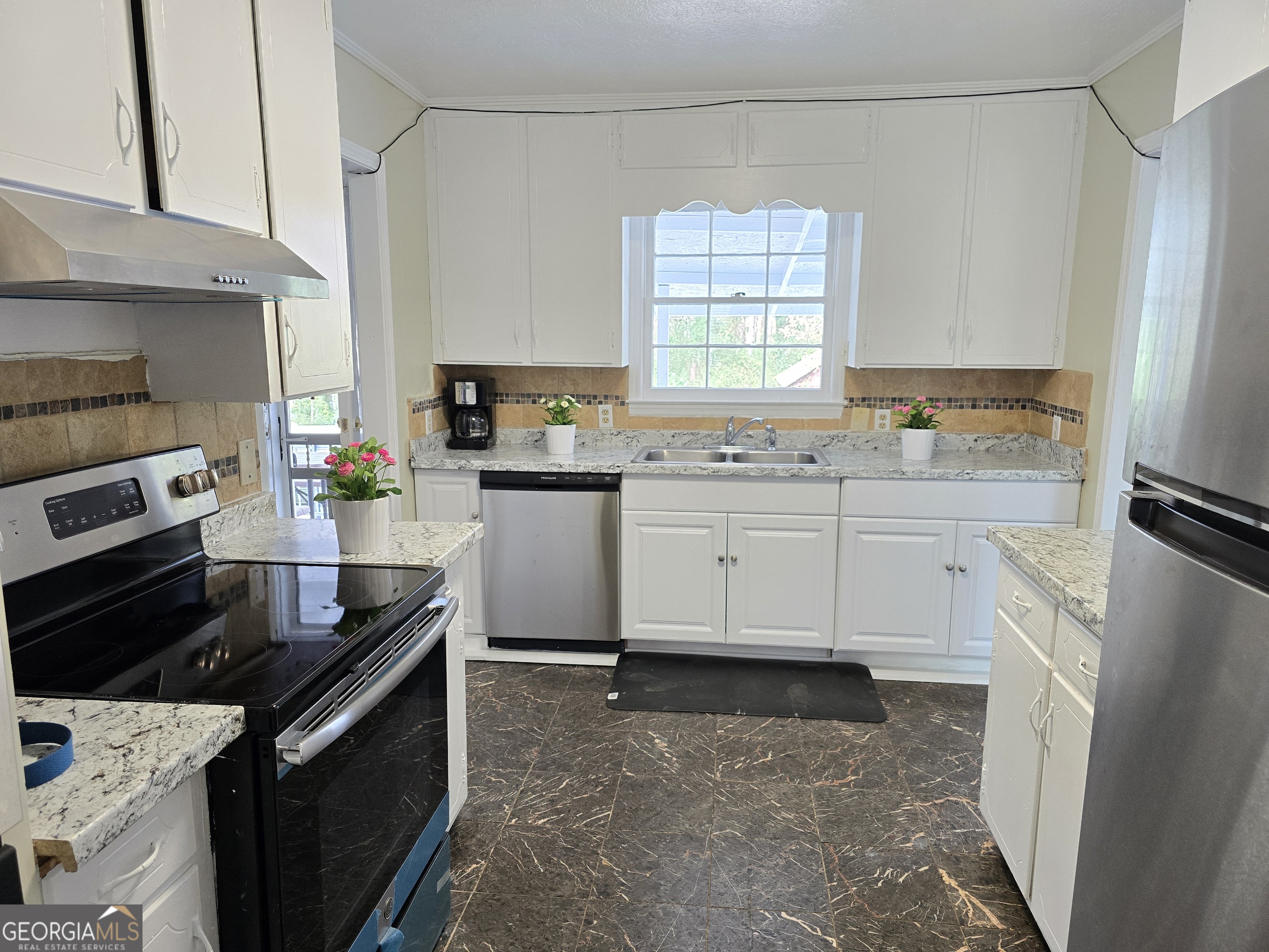 1903 Ridgewood Drive West Point, GA 31833 - Photo 9 of 27 a kitchen with a sink stove and refrigerator