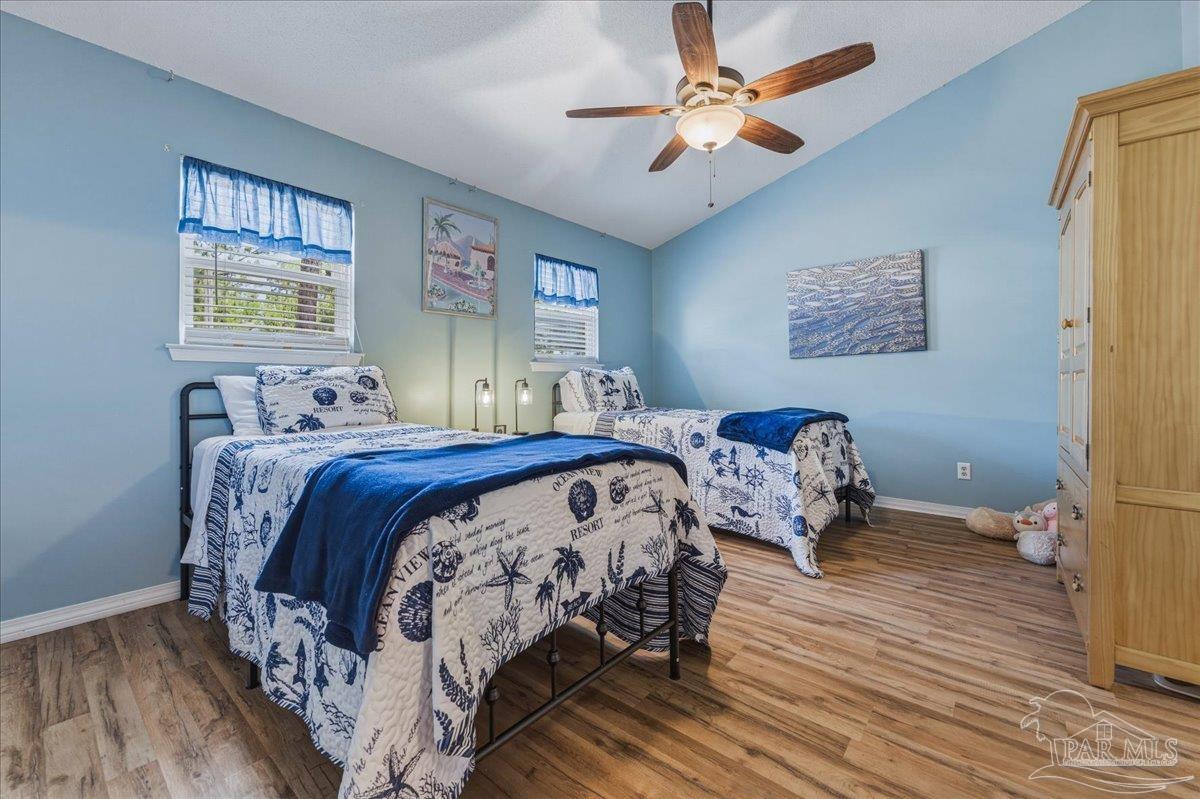 26063 Canal Road, Unit 3F Orange Beach, AL 36561 - Photo 55 of 72 a bedroom with double bed and a window