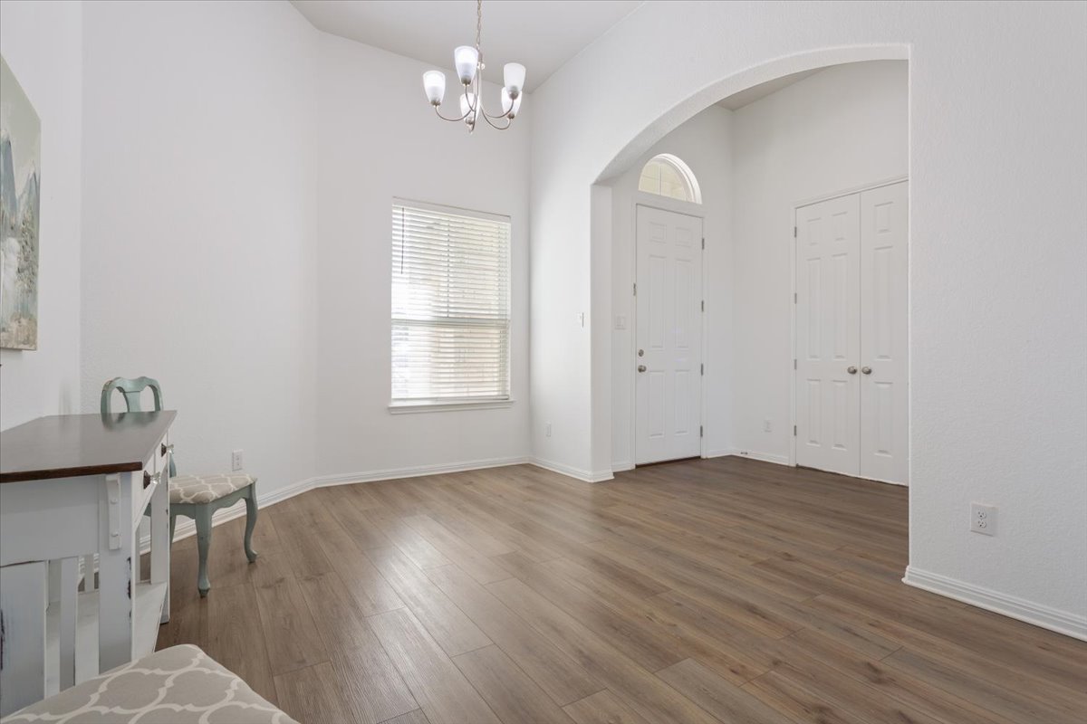 3625 Garrano Bend Leander, TX 78641 - Photo 8 of 38 A graceful arched entry welcomes all to this naturally illuminated space with resilient plank flooring.