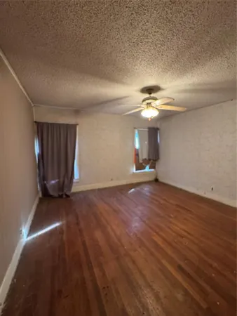 a view of an empty room with a chandelier