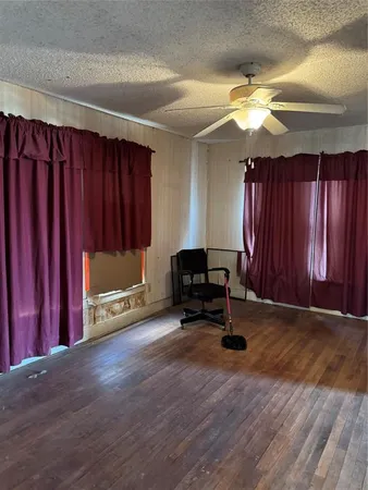 a large kitchen with stainless steel appliances a large counter top a stove a chimney a sink and dishwasher