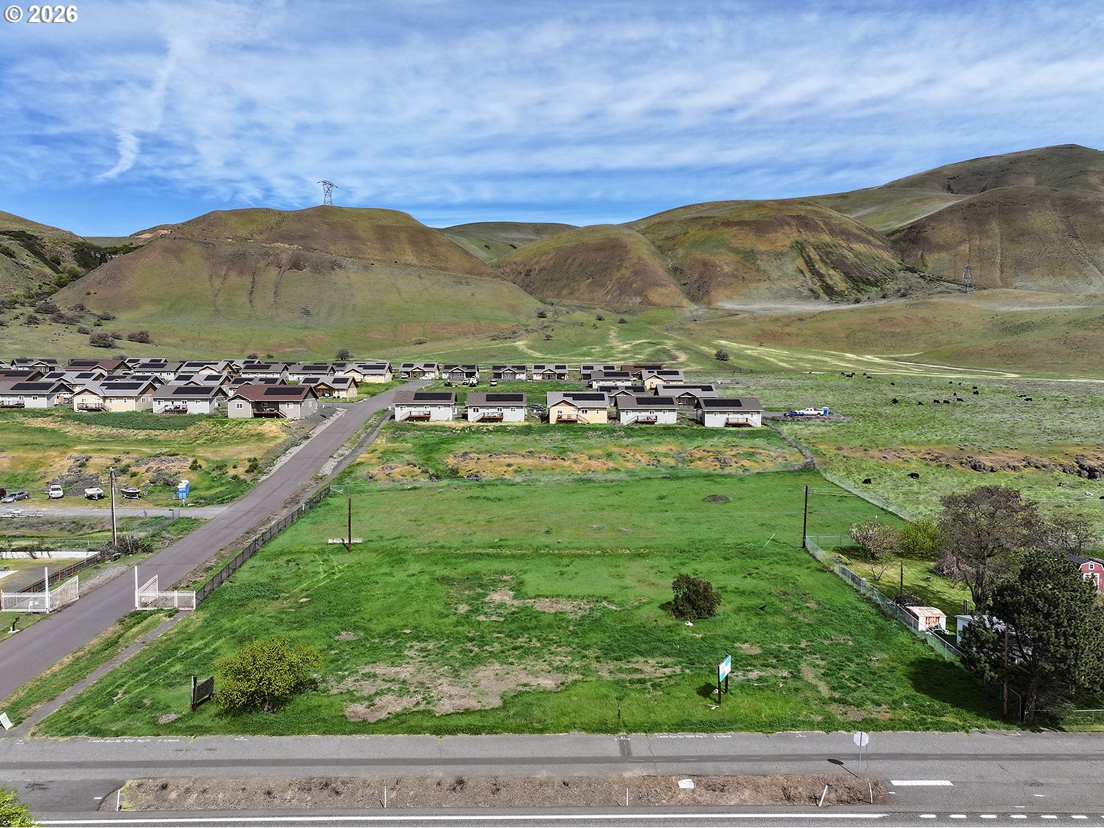 9255 Highway 14 Wishram, WA 98673 - Photo 23 of 37 a view of a lush green hillside and houses