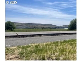 a view of a street with an ocean view