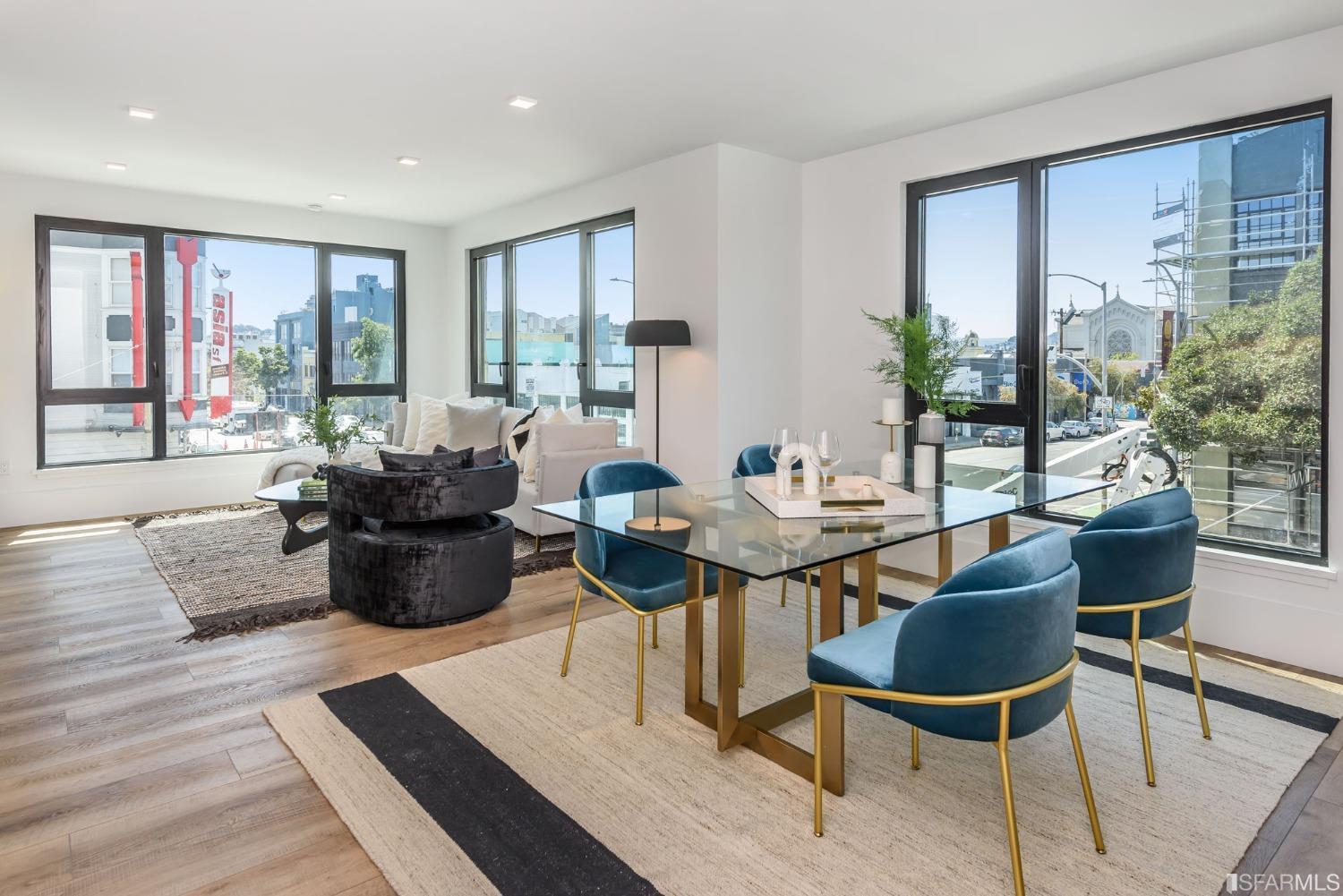 a view of a dining room with furniture window and wooden floor