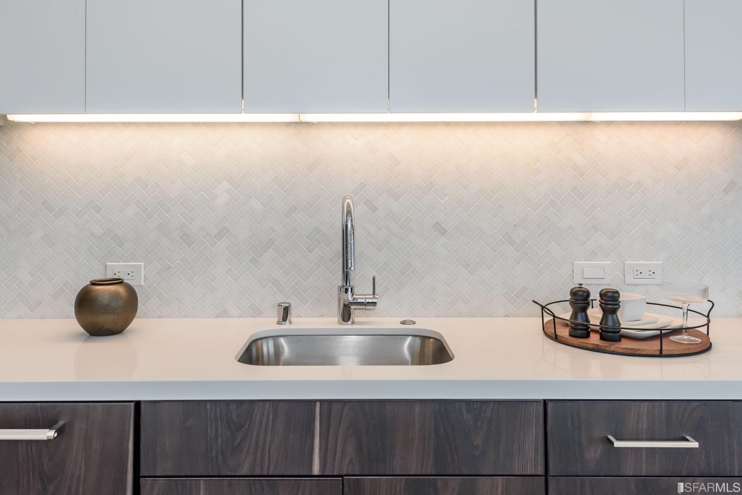 1288 Howard Street, Unit 611 San Francisco, CA 94103 - Photo 9 of 48 a bathroom with a sink and a mirror